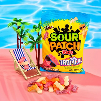 Sour Patch Kids Tropical candy pack featuring fruity gummies in a fun beach-themed setting