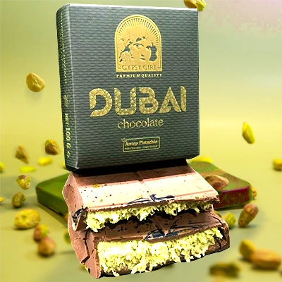 Dubai chocolate with Antep pistachio filling, featuring premium Gypsy Girl packaging and rich chocolate layers with scattered pistachios.