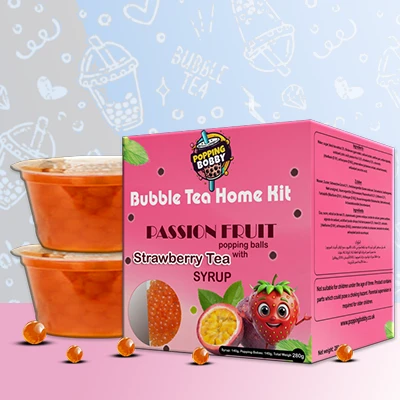 Popping Bobby Bubble Tea Home Kit with Passion Fruit Popping Balls and Strawberry Tea Syrup for a flavorful DIY bubble tea treat.