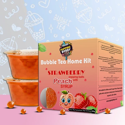 Popping Bobby Bubble Tea Home Kit with Strawberry Popping Balls and Peach Syrup, perfect for a refreshing DIY bubble tea treat.