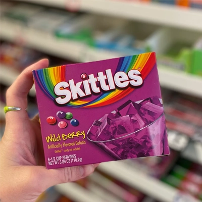 Skittles Wild Berry candy box featuring bold purple packaging and fruity flavors