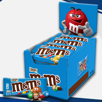 cispy M&M's packs with colorful candy-coated chocolate, presented in a bold blue display featuring the iconic M&M's characters.