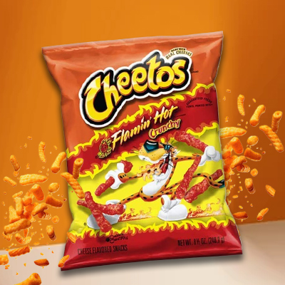 Bag of Cheetos Flamin' Hot Crunchy snacks with fiery red cheese curls exploding around the packaging.