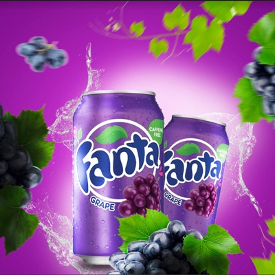 Fanta Grape cans surrounded by vibrant grapes and splashes of purple juice.
