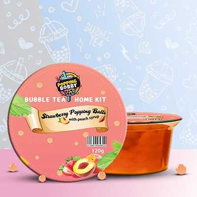 Popping Bobby Bubble Tea Home Kit with Strawberry Popping Balls and Peach Syrup for a fruity and refreshing DIY bubble tea experience.
